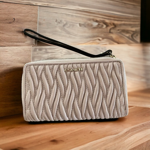 Coach Handbags - COACH blush color zip around wristlet wallet.  Like new!